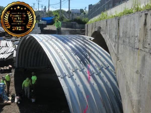 rehabilitation of an existing concrete arch custom buried bridge