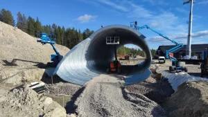 Large structural plate tunnel supporting new ski resort infrastructure and gondola access.