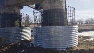 Galvanized structural plate forms prepared for reinforced concrete placement during bridge rehabilitation.