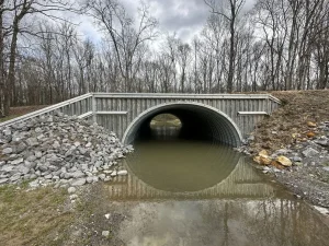 IMG_2779_resized New corrugated steel culvert installed beneath a roadway as part of an Alabama fish habitat restoration project.