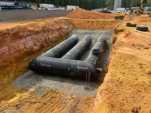 Installation and backfill operations last manifold polymer coated stormwater detention